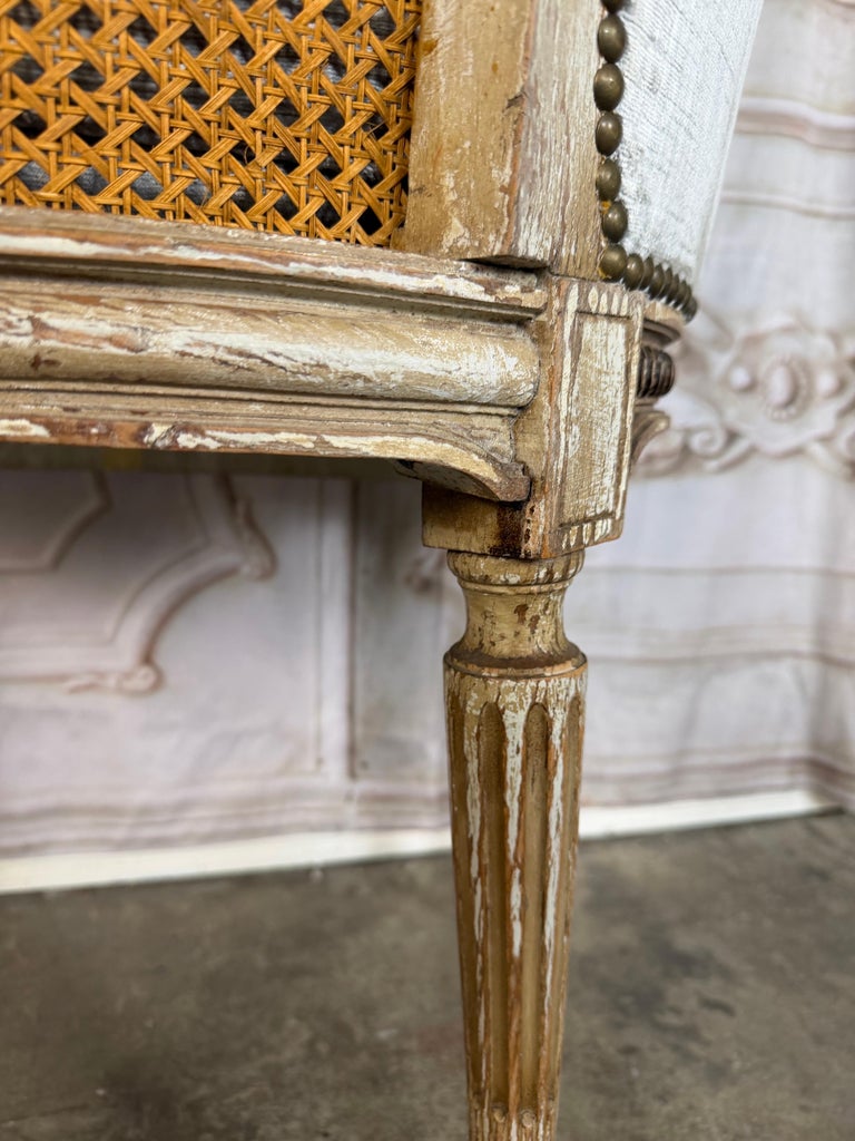 Antique French Louis XVI Style Painted Bergère Chair with Cane Back