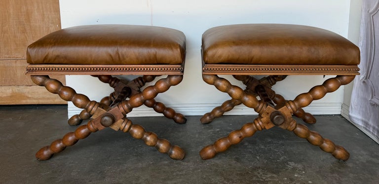 Pair of Spanish Colonial Baroque Bobbin - X-Base Stools with Distressed Leather