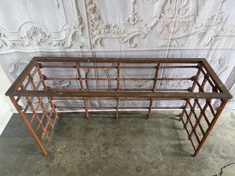 Rustic Console Table with Textured Stone Top and Hand-Forged Iron Base