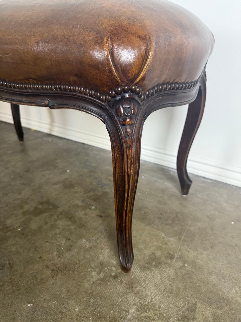 French Louis XV Style Carved Bench with Distressed Leather Upholstery