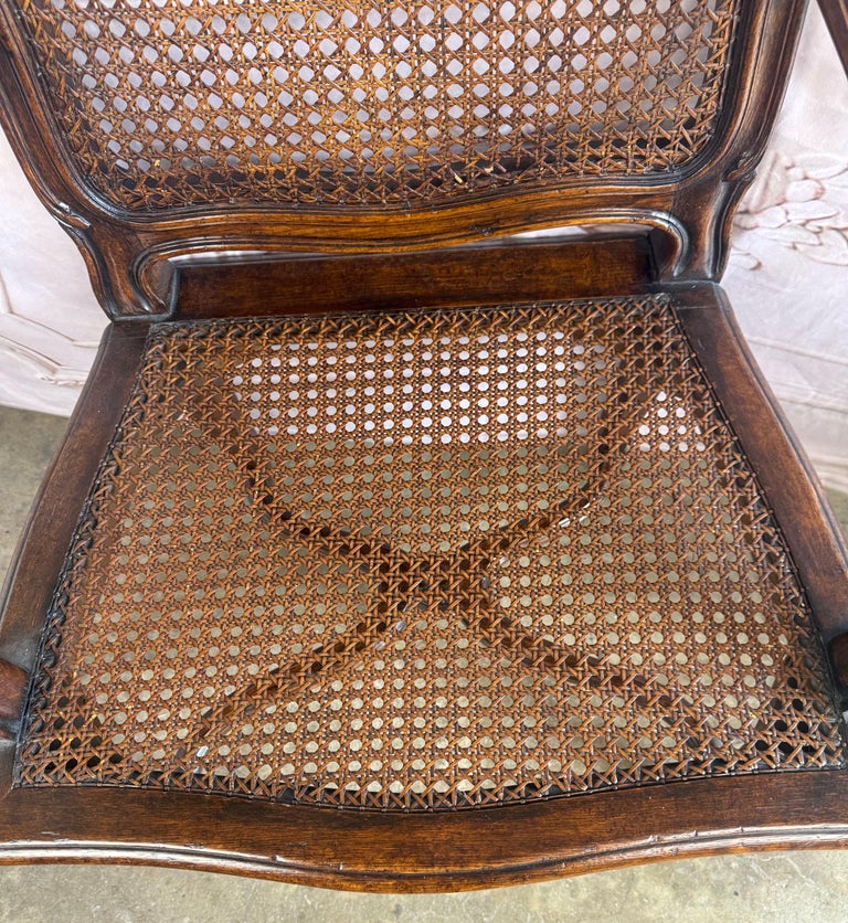 Eight French Provincial-style dining chairs