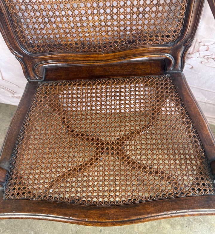 Eight French Provincial-style dining chairs
