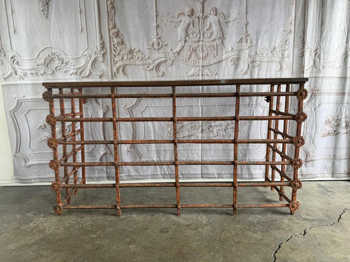 Rustic Console Table with Textured Stone Top and Hand-Forged Iron Base