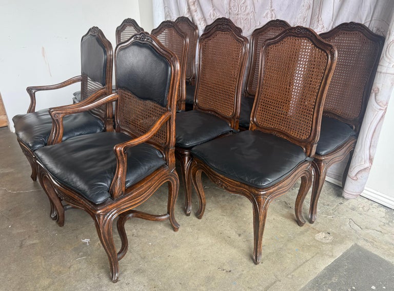 Eight French Provincial-style dining chairs