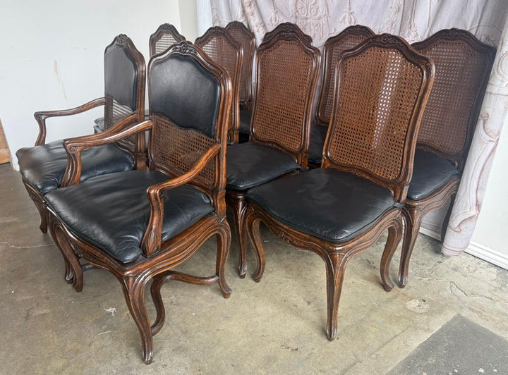 Eight French Provincial-style dining chairs
