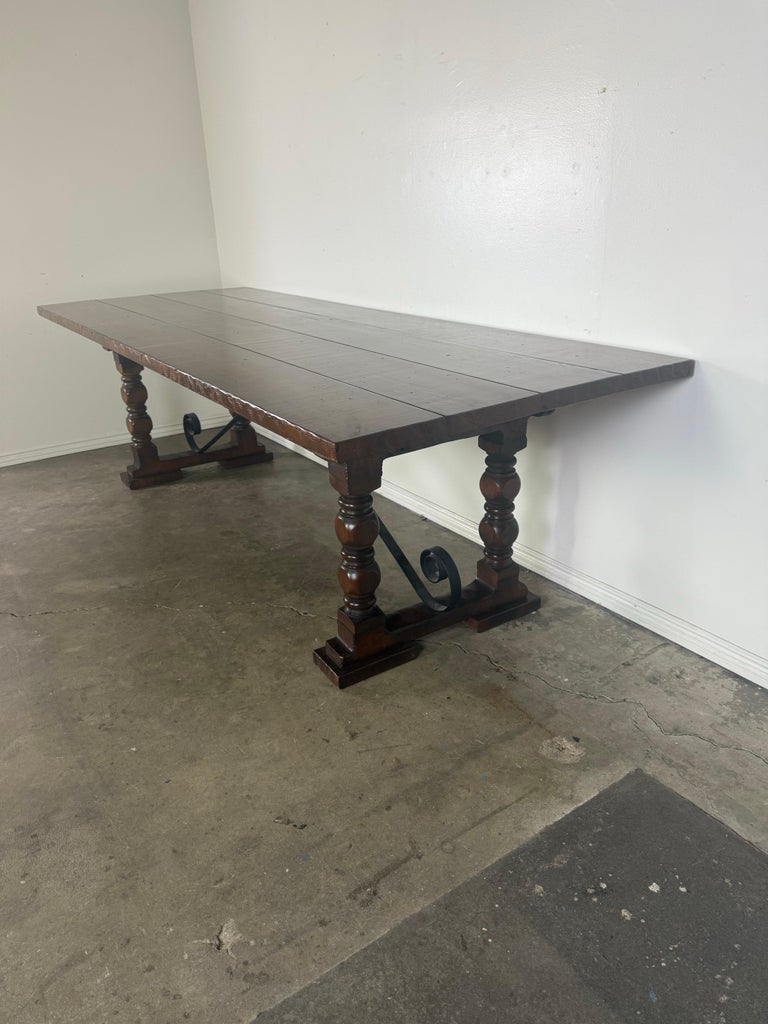 Monumental Spanish Revival Style Walnut Trestle Dining Table with Hand-Hewn Top