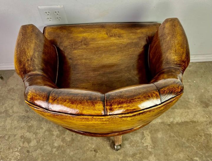 Pair of Mid-Century Leather Tufted Armchairs on Swivels