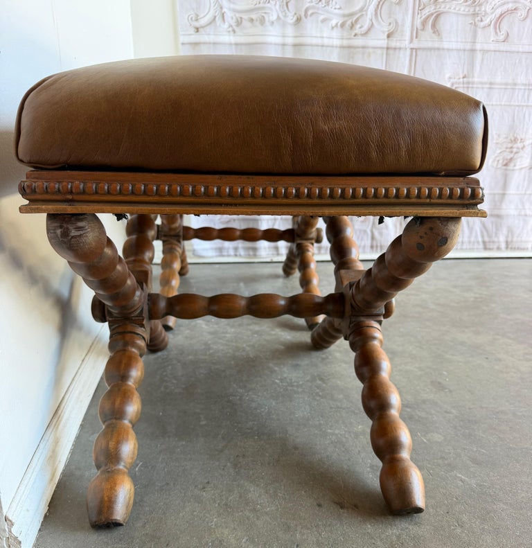 Pair of Spanish Colonial Baroque Bobbin - X-Base Stools with Distressed Leather