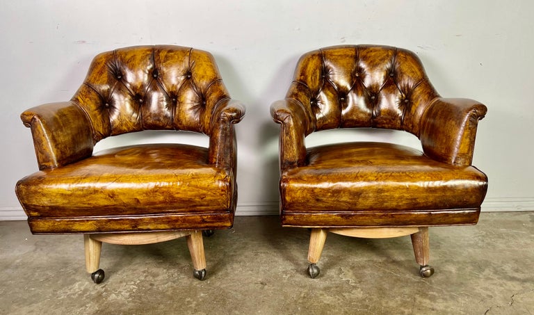 Pair of Mid-Century Leather Tufted Armchairs on Swivels