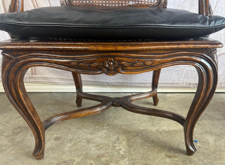 Eight French Provincial-style dining chairs