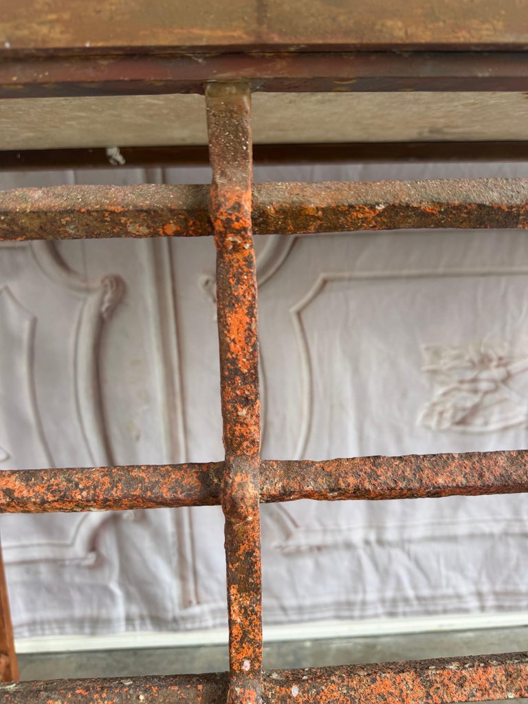 Rustic Console Table with Textured Stone Top and Hand-Forged Iron Base