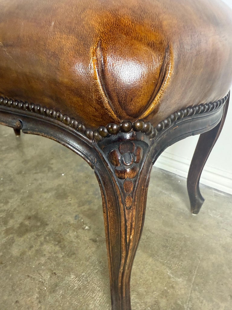 French Louis XV Style Carved Bench with Distressed Leather Upholstery