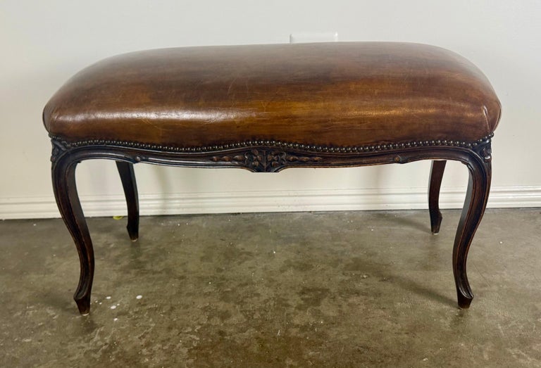 French Louis XV Style Carved Bench with Distressed Leather Upholstery