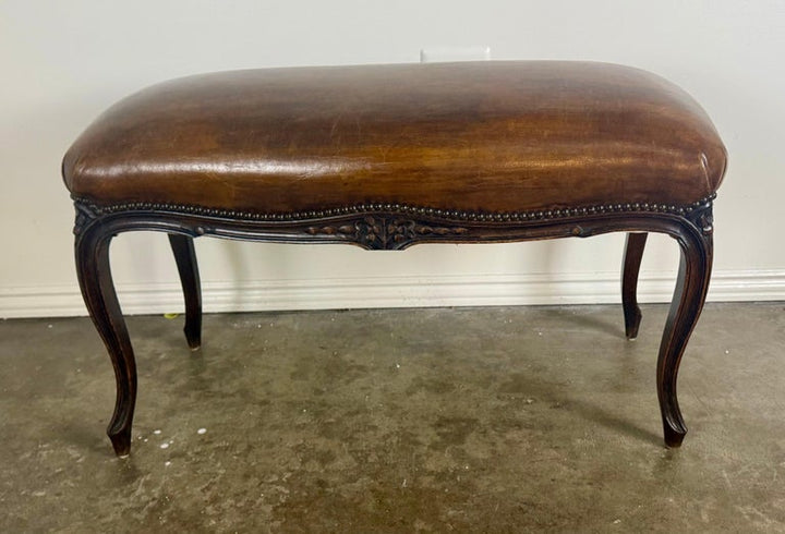 French Louis XV Style Carved Bench with Distressed Leather Upholstery