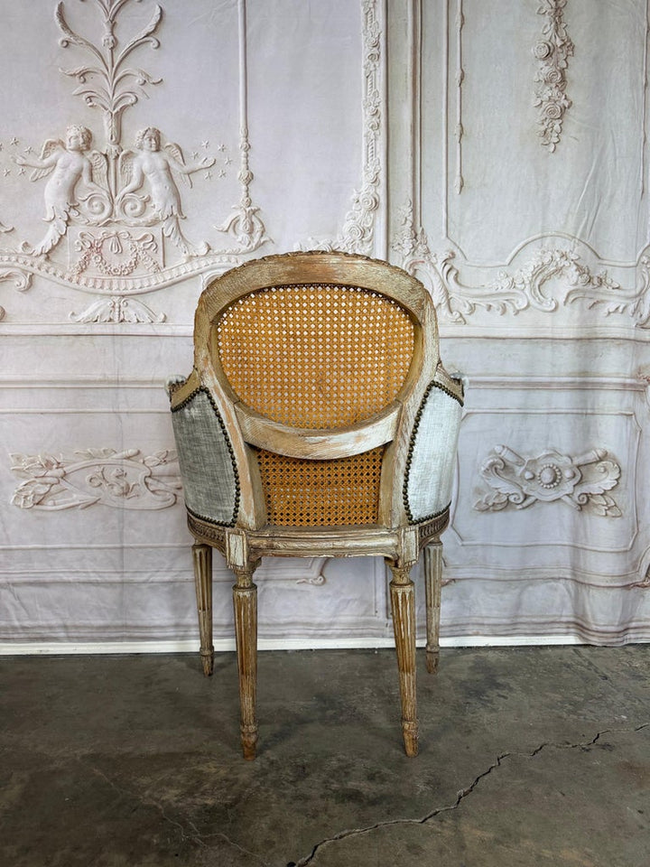 Antique French Louis XVI Style Painted Bergère Chair with Cane Back