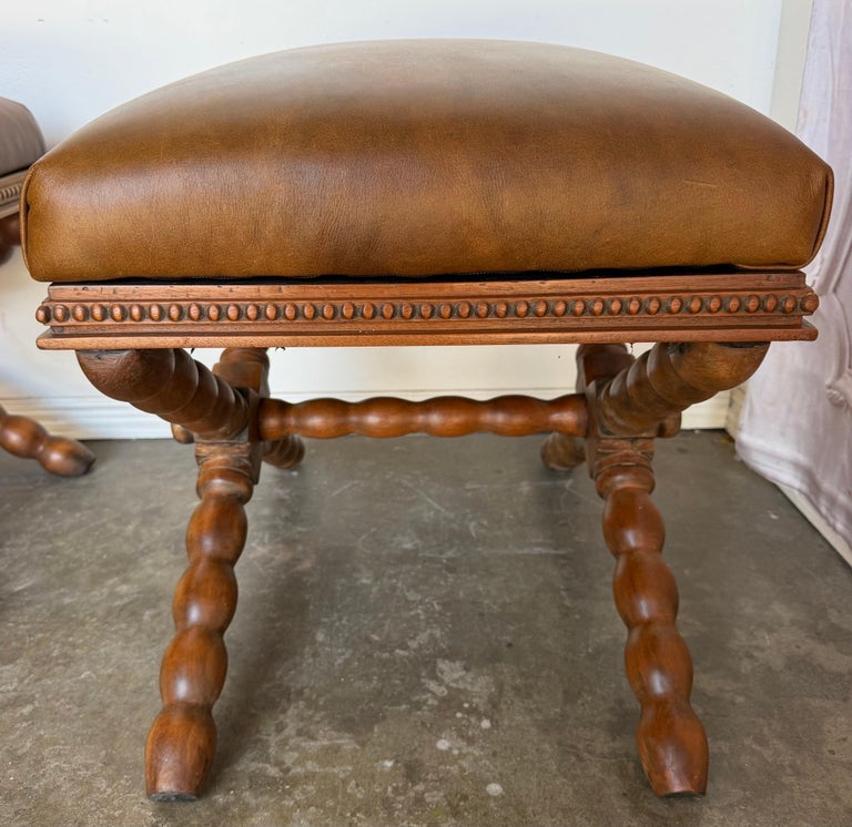 Pair of Spanish Colonial Baroque Bobbin - X-Base Stools with Distressed Leather