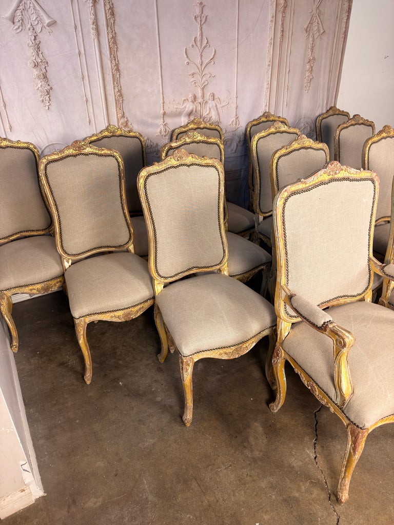 Set of 14 French Louis XV Style Gilt Dining Chairs with Linen Upholstery