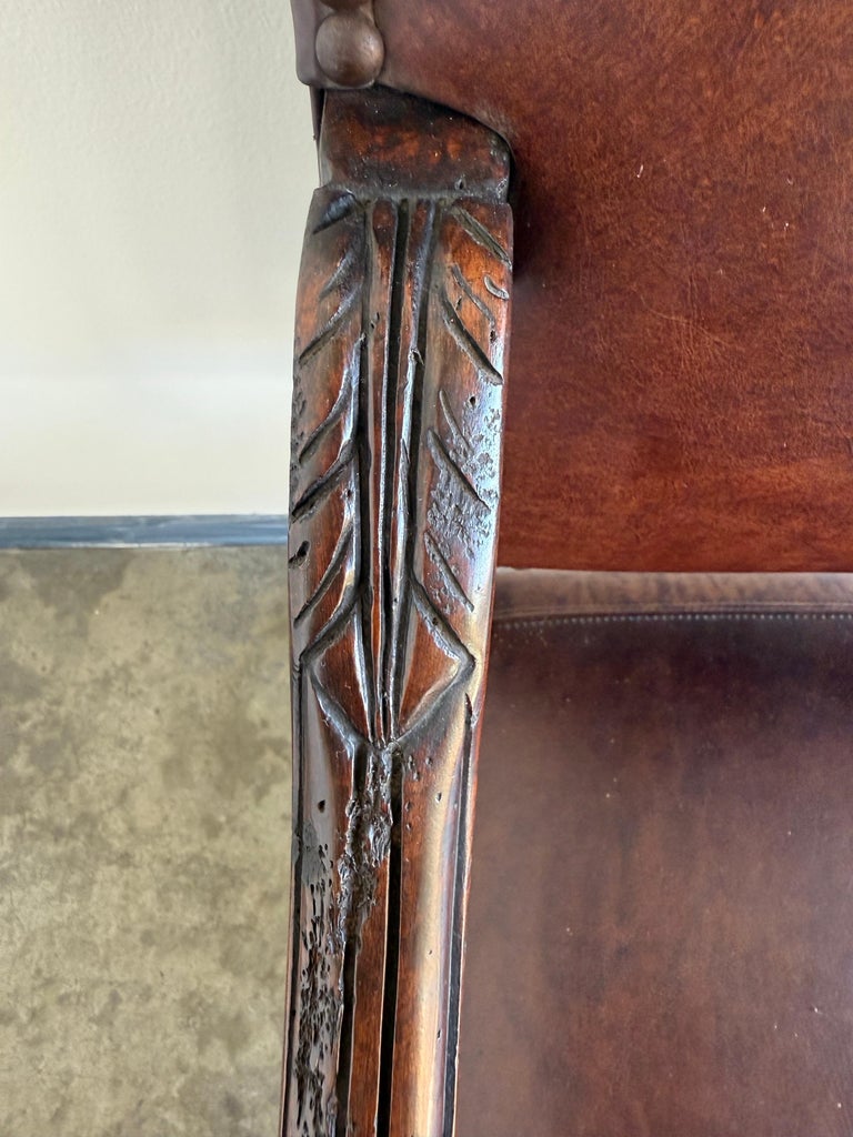 Set of Eight Spanish Revival Leather and Carved Walnut Dining Chairs
