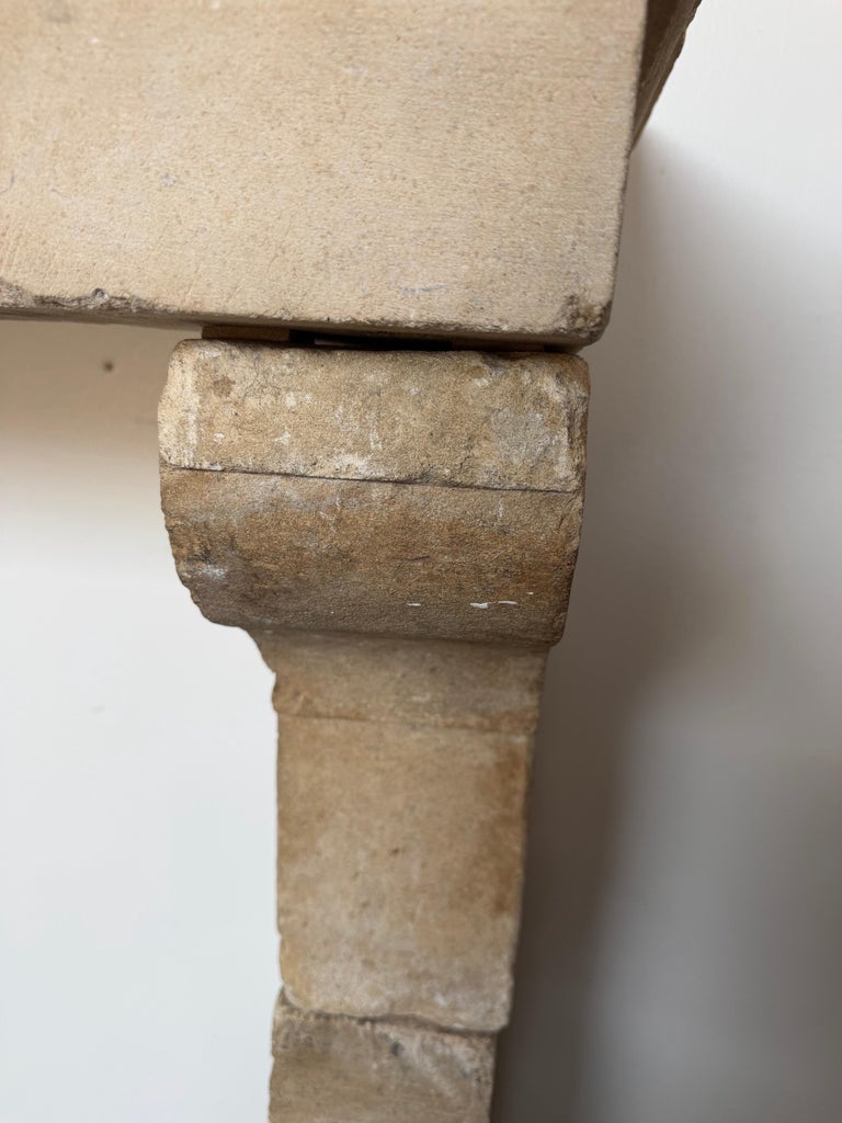 Petite 18th Century French Limestone Fireplace Mantel With Scrolled Corbels