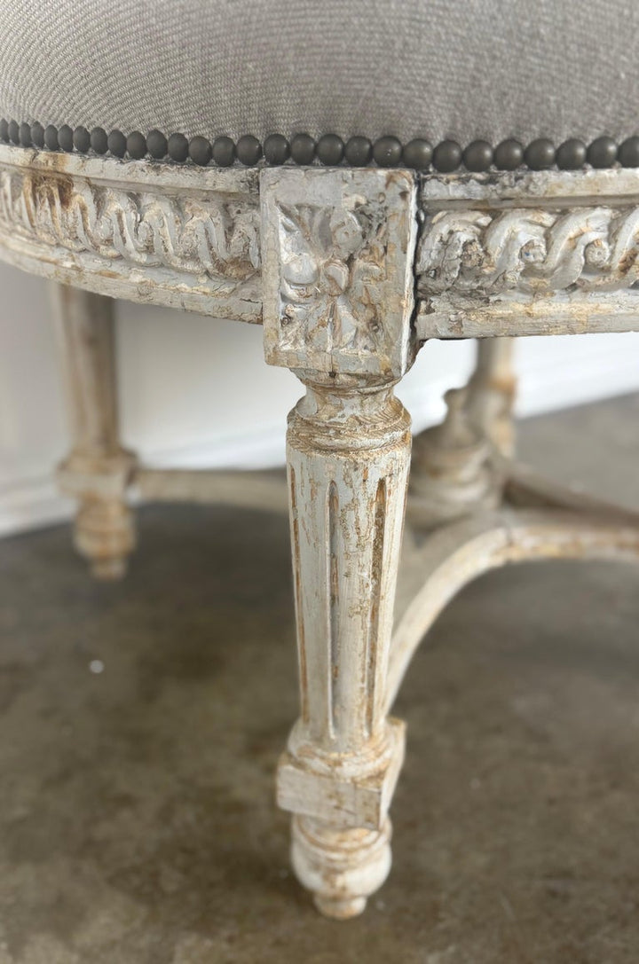 French Neoclassical upholstered ottoman, early 20th century.