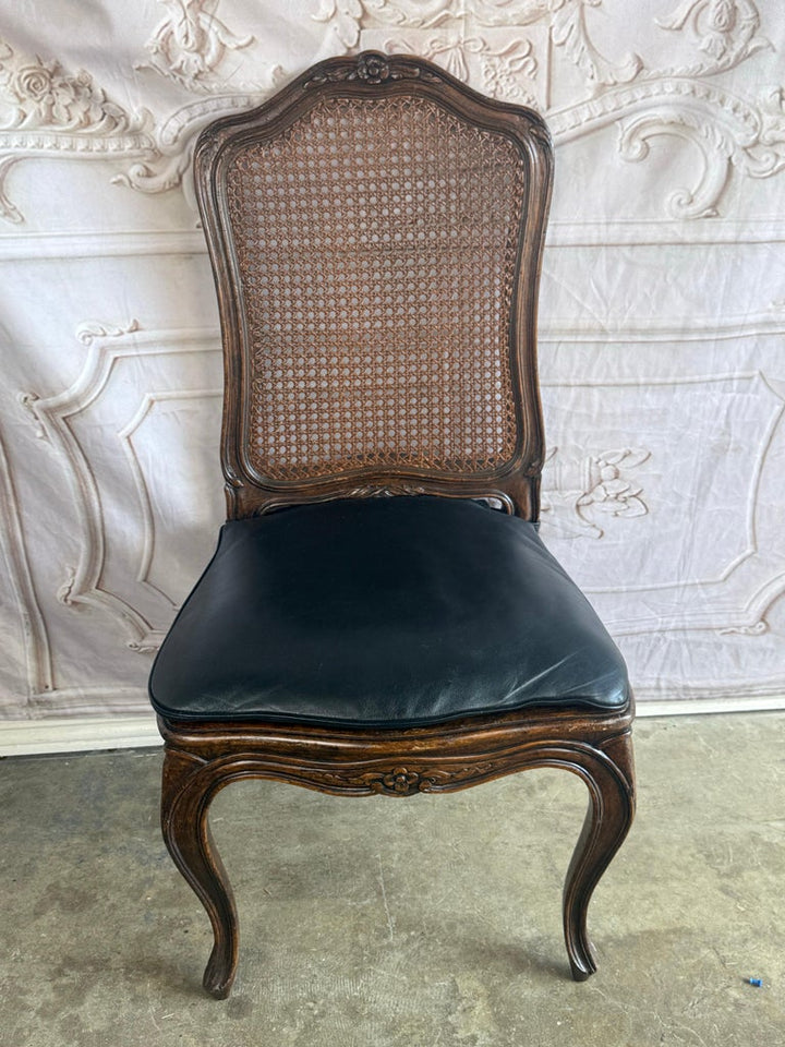 Eight French Provincial-style dining chairs