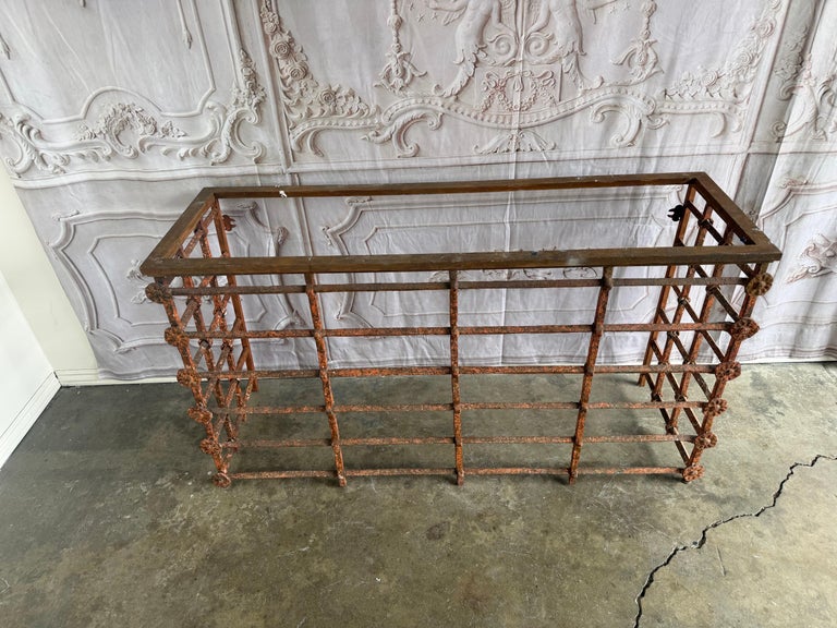 Rustic Console Table with Textured Stone Top and Hand-Forged Iron Base
