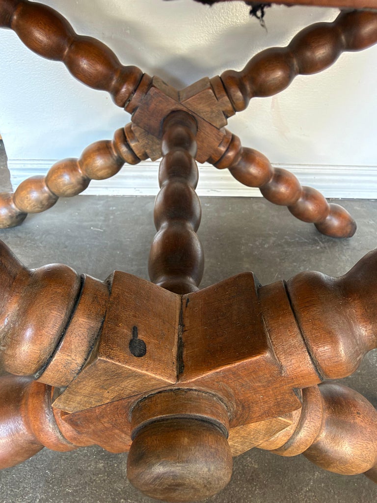 Pair of Spanish Colonial Baroque Bobbin - X-Base Stools with Distressed Leather
