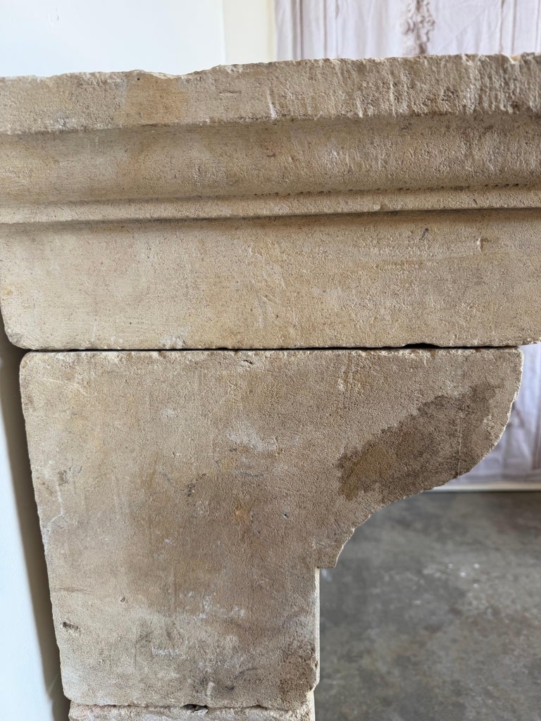Petite 18th Century French Limestone Fireplace Mantel With Scrolled Corbels