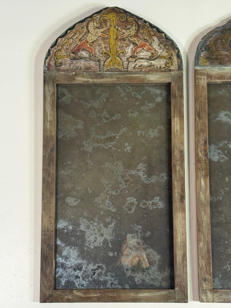 Pair of 19th Century Painted Folk Art Arched Mirrors with Heraldic Lion Crests