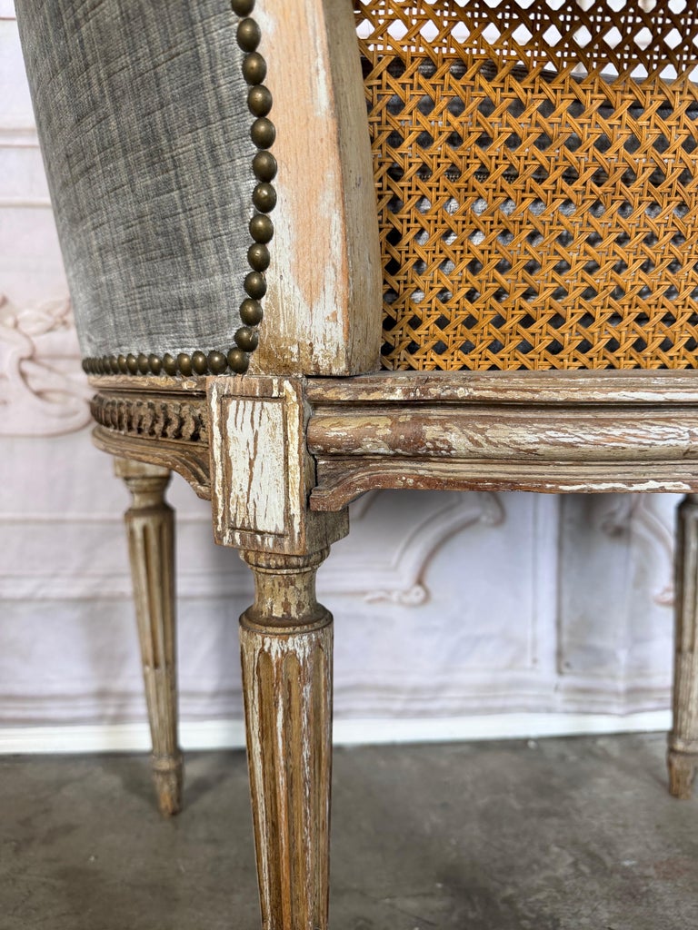 Antique French Louis XVI Style Painted Bergère Chair with Cane Back