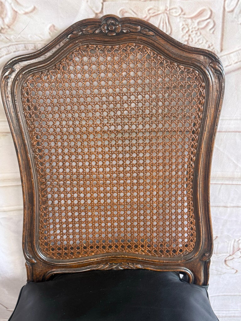 Eight French Provincial-style dining chairs