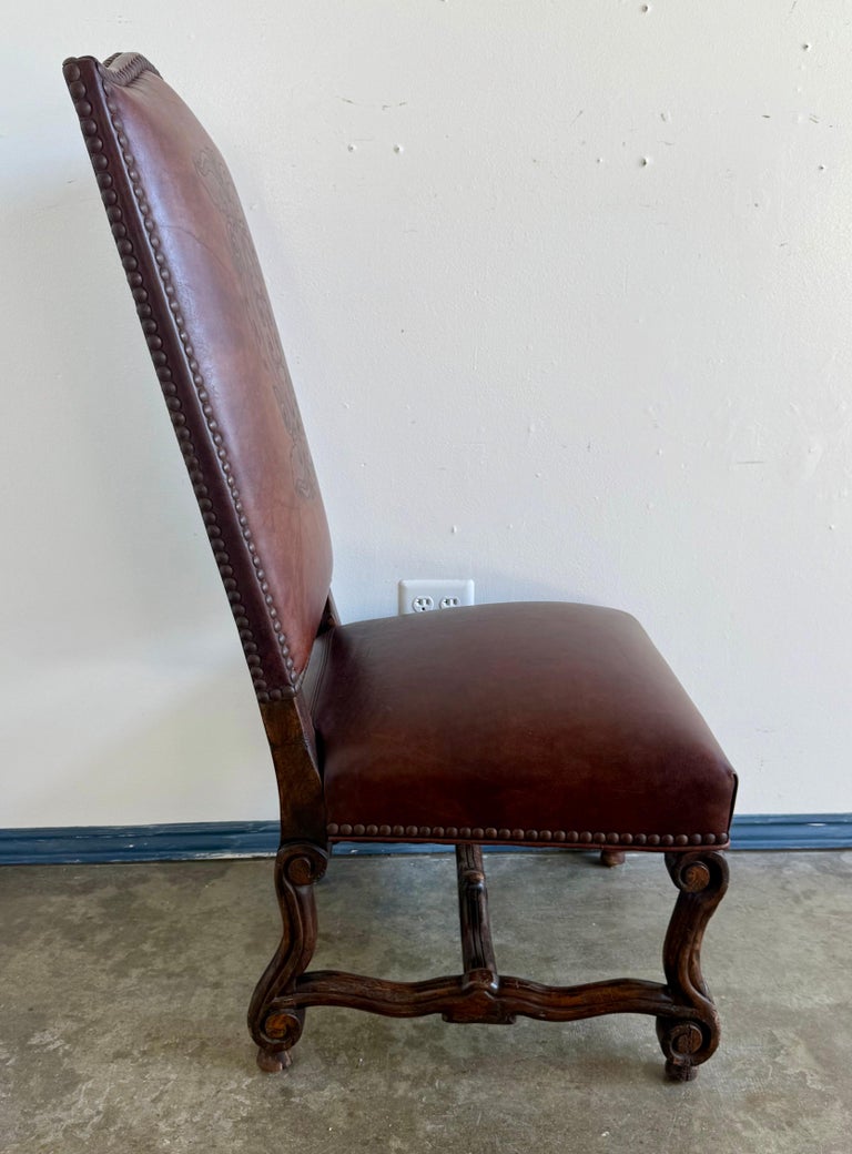 Set of Eight Spanish Revival Leather and Carved Walnut Dining Chairs
