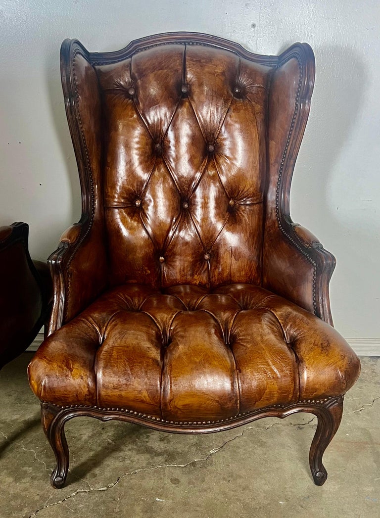 Pair of French Leather Tufted Wingback Chairs C. 1930