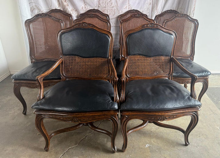 Eight French Provincial-style dining chairs