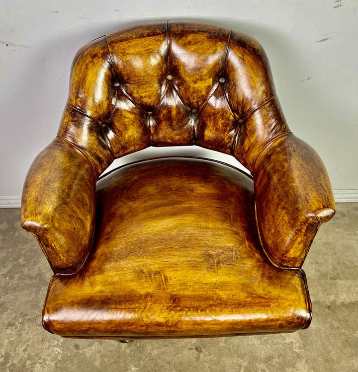 Pair of Mid-Century Leather Tufted Armchairs on Swivels