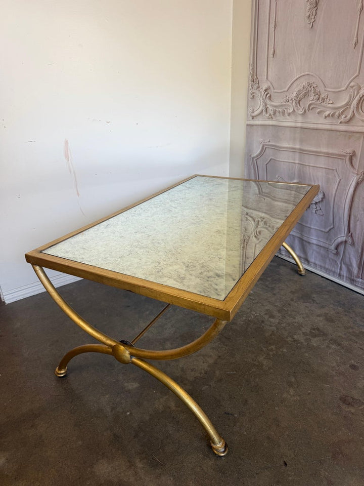 Curule Gilt Iron Coffee Table with Antiqued Mirror Top by Miamar Home