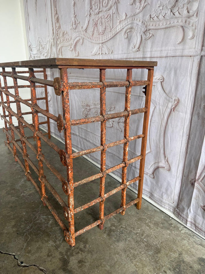 Rustic Console Table with Textured Stone Top and Hand-Forged Iron Base