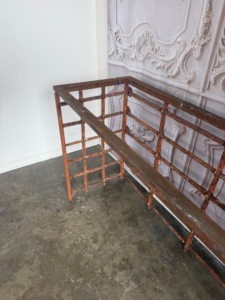 Rustic Console Table with Textured Stone Top and Hand-Forged Iron Base
