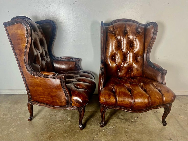 Pair of French Leather Tufted Wingback Chairs C. 1930