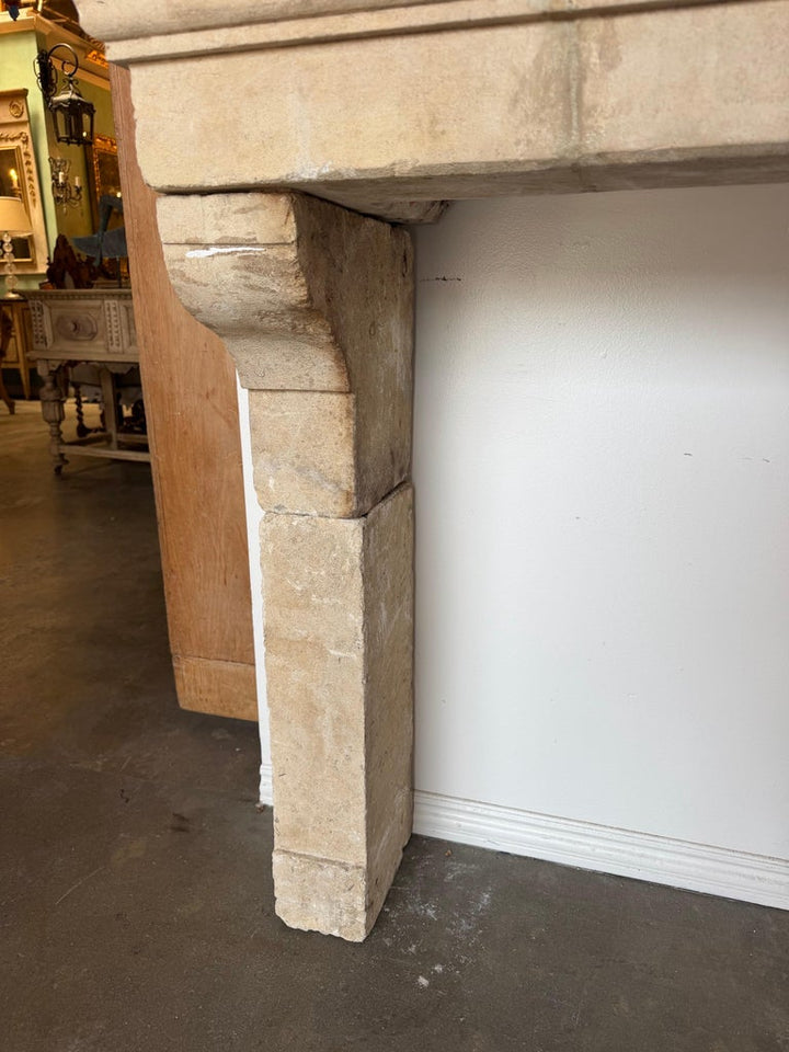 Petite 18th Century French Limestone Fireplace Mantel With Scrolled Corbels