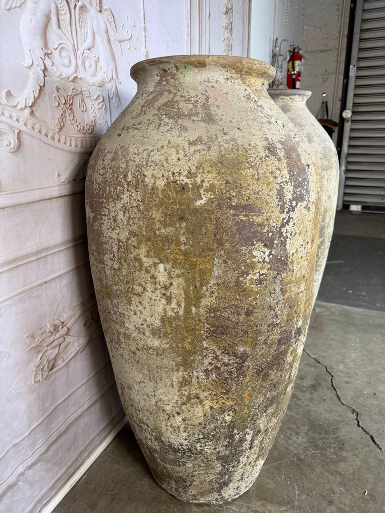 Pair of Monumental Terracotta Olive Jars with Weathered Patina
