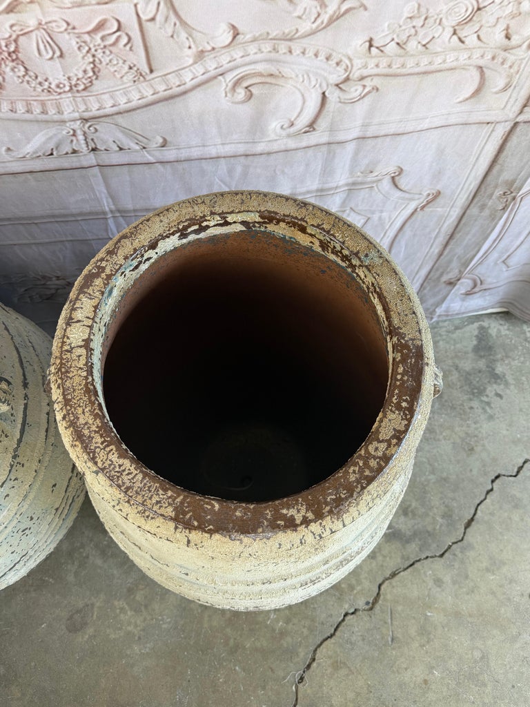 Pair of Large Distressed Mediterranean Style Terracotta Olive Jars with Handles