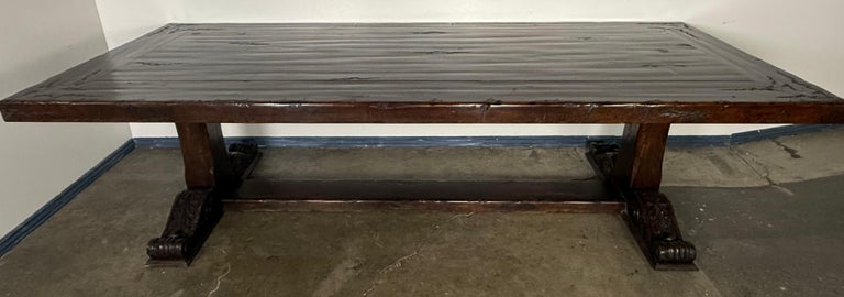 Monumental Spanish Revival Carved Trestle Dining Table, Early 20th Century