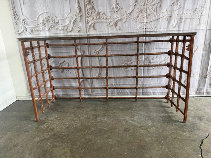 Rustic Console Table with Textured Stone Top and Hand-Forged Iron Base
