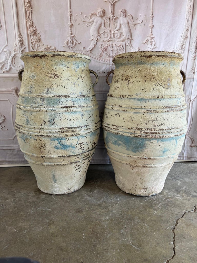 Pair of Large Distressed Mediterranean Style Terracotta Olive Jars with Handles