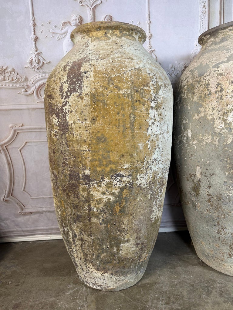 Pair of Monumental Terracotta Olive Jars with Weathered Patina
