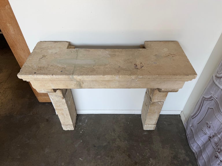 Petite 18th Century French Limestone Fireplace Mantel With Scrolled Corbels