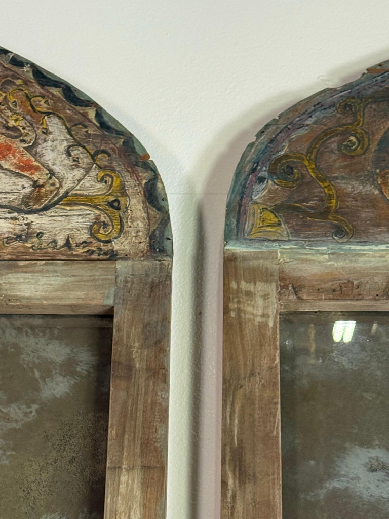 Pair of 19th Century Painted Folk Art Arched Mirrors with Heraldic Lion Crests