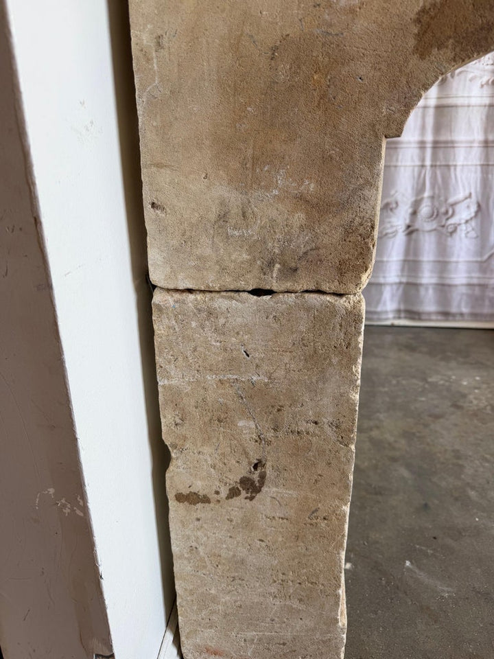 Petite 18th Century French Limestone Fireplace Mantel With Scrolled Corbels