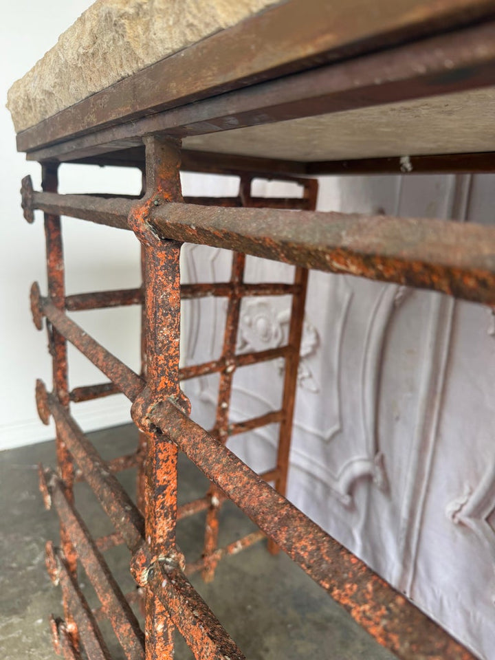 Rustic Console Table with Textured Stone Top and Hand-Forged Iron Base